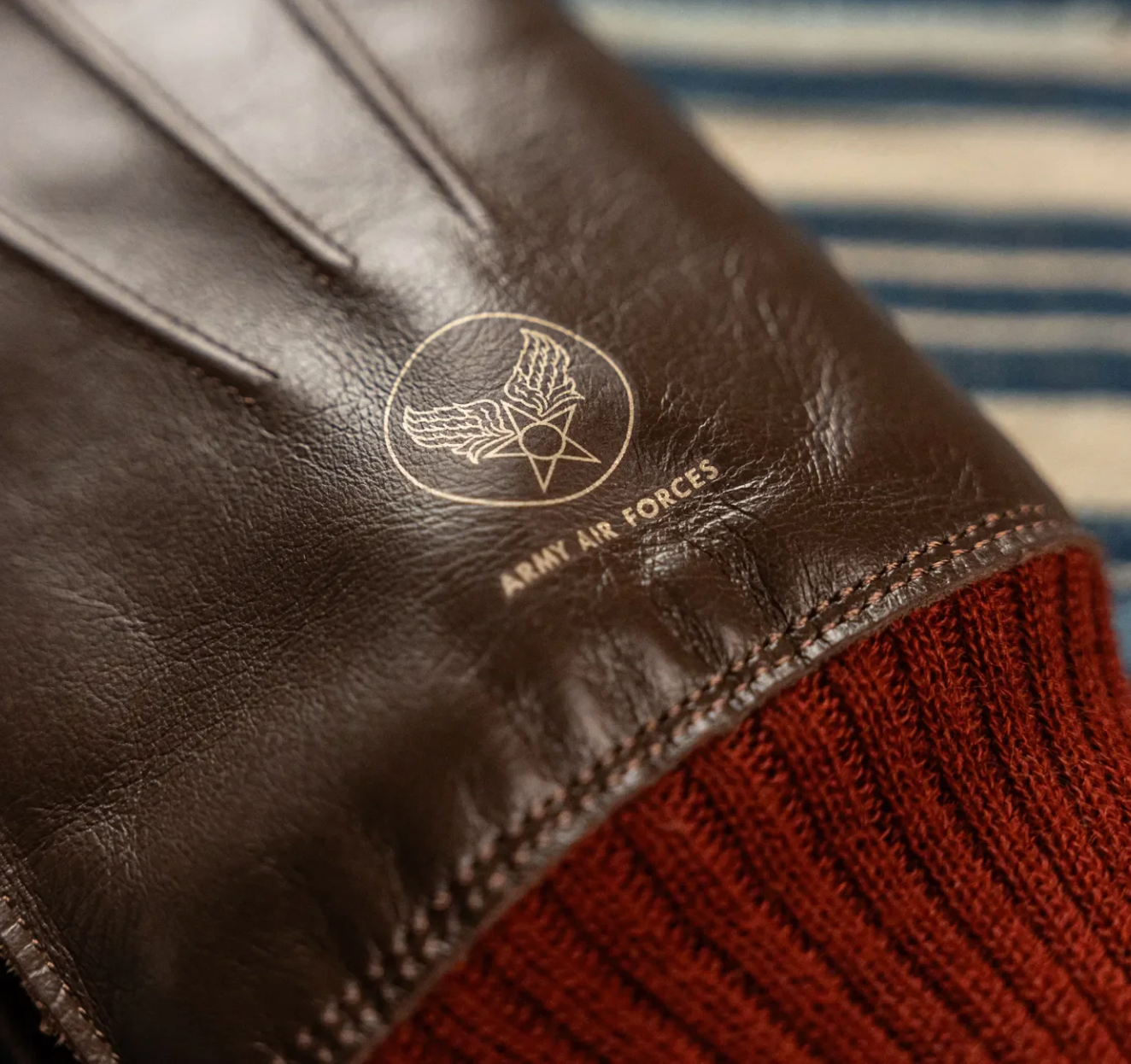 Detail of Buzz Rickson's Type A-10 Glove showcasing the red ribbed cuff.