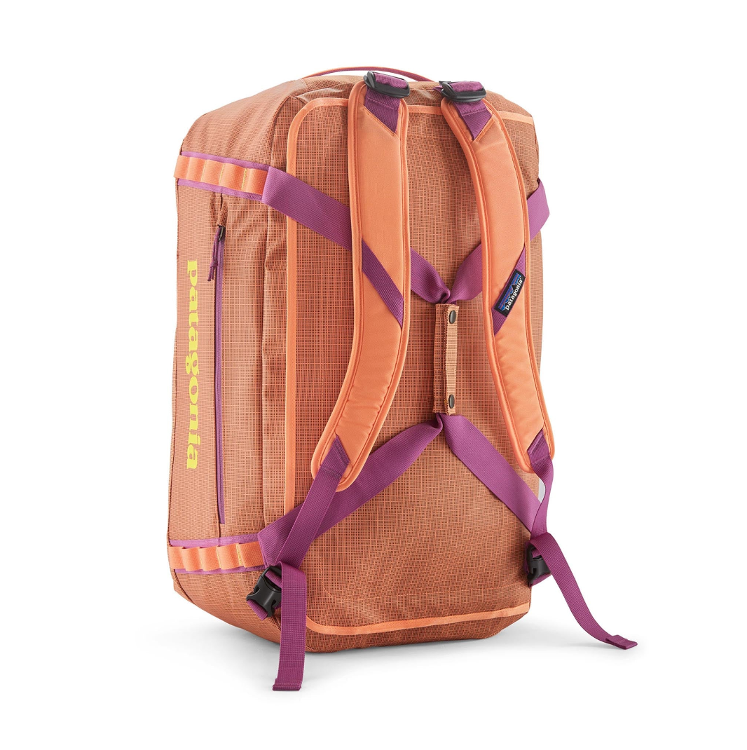 Black Hole Duffel 55L by Patagonia, vibrant Peach Sherbet, perfect for adventures.