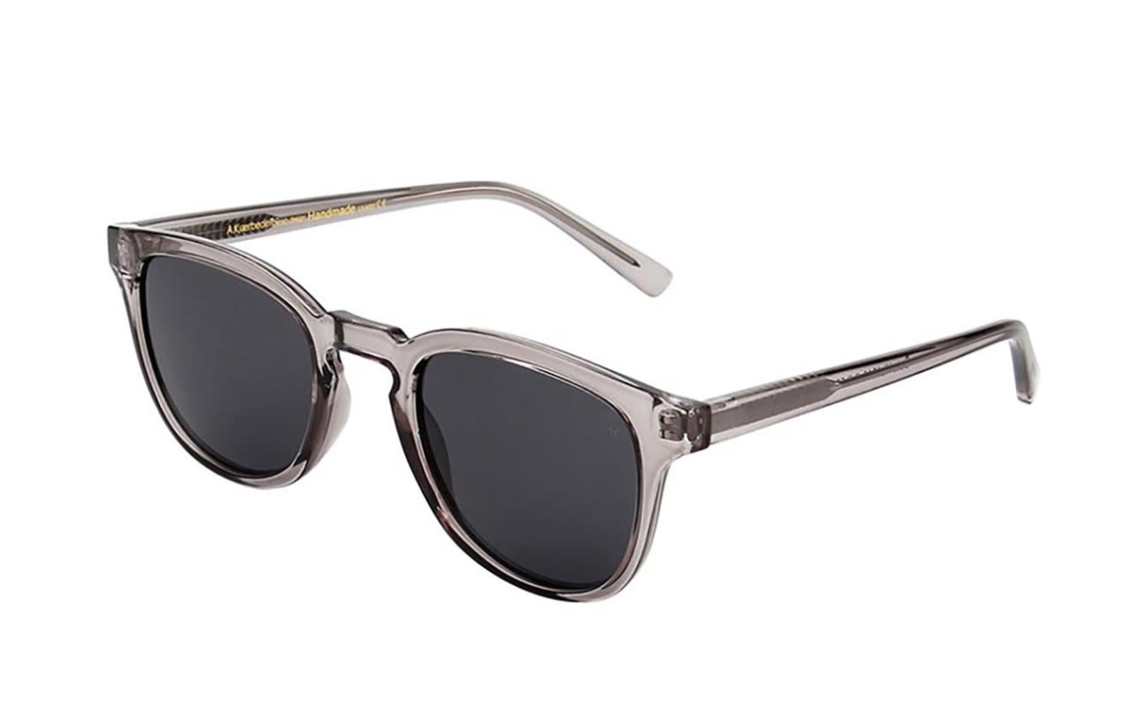 Angled view of Bate Grey Transparent sunglasses by A. Kjærbede, made with sustainable materials.