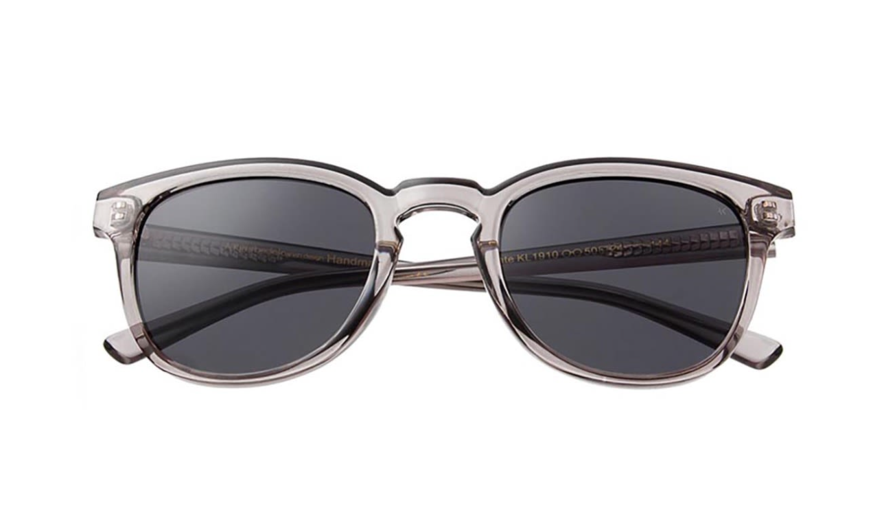 Side view of Bate Grey Transparent sunglasses by A. Kjærbede, showcasing the design.
