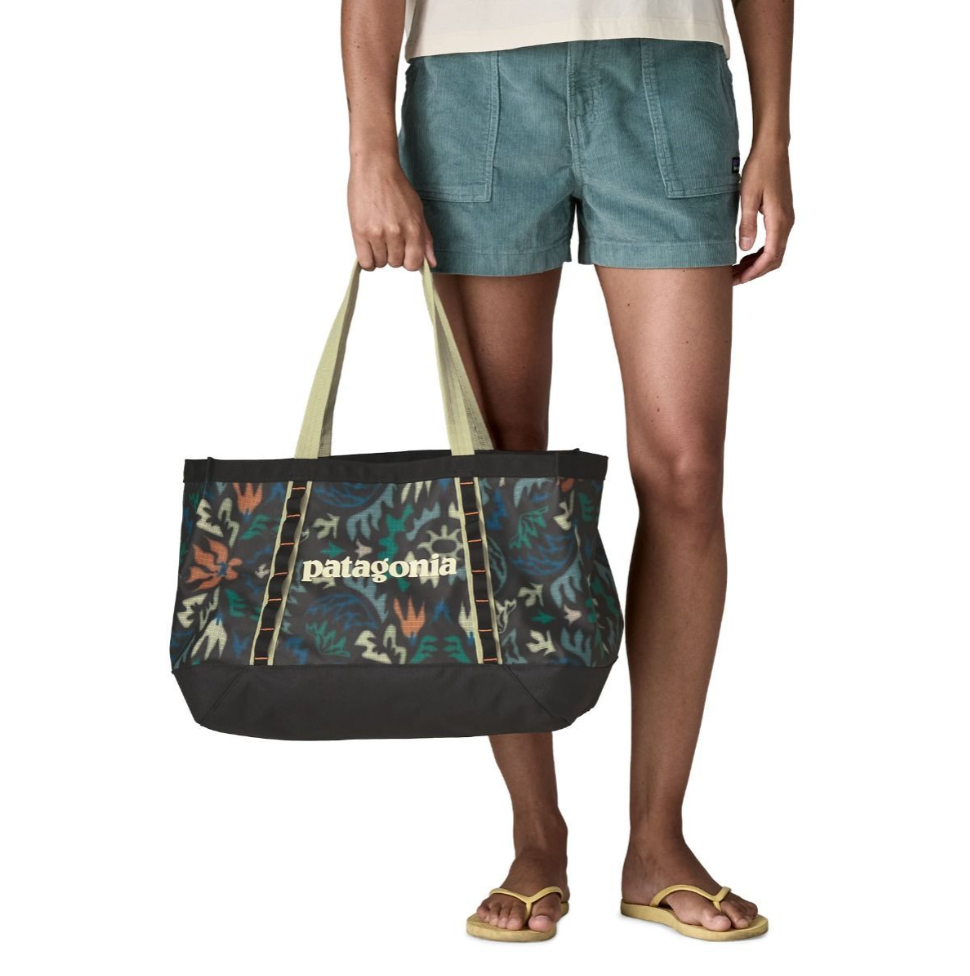 Patagonia Black Hole Tote 25L made from recycled polyester with black kaleido print.