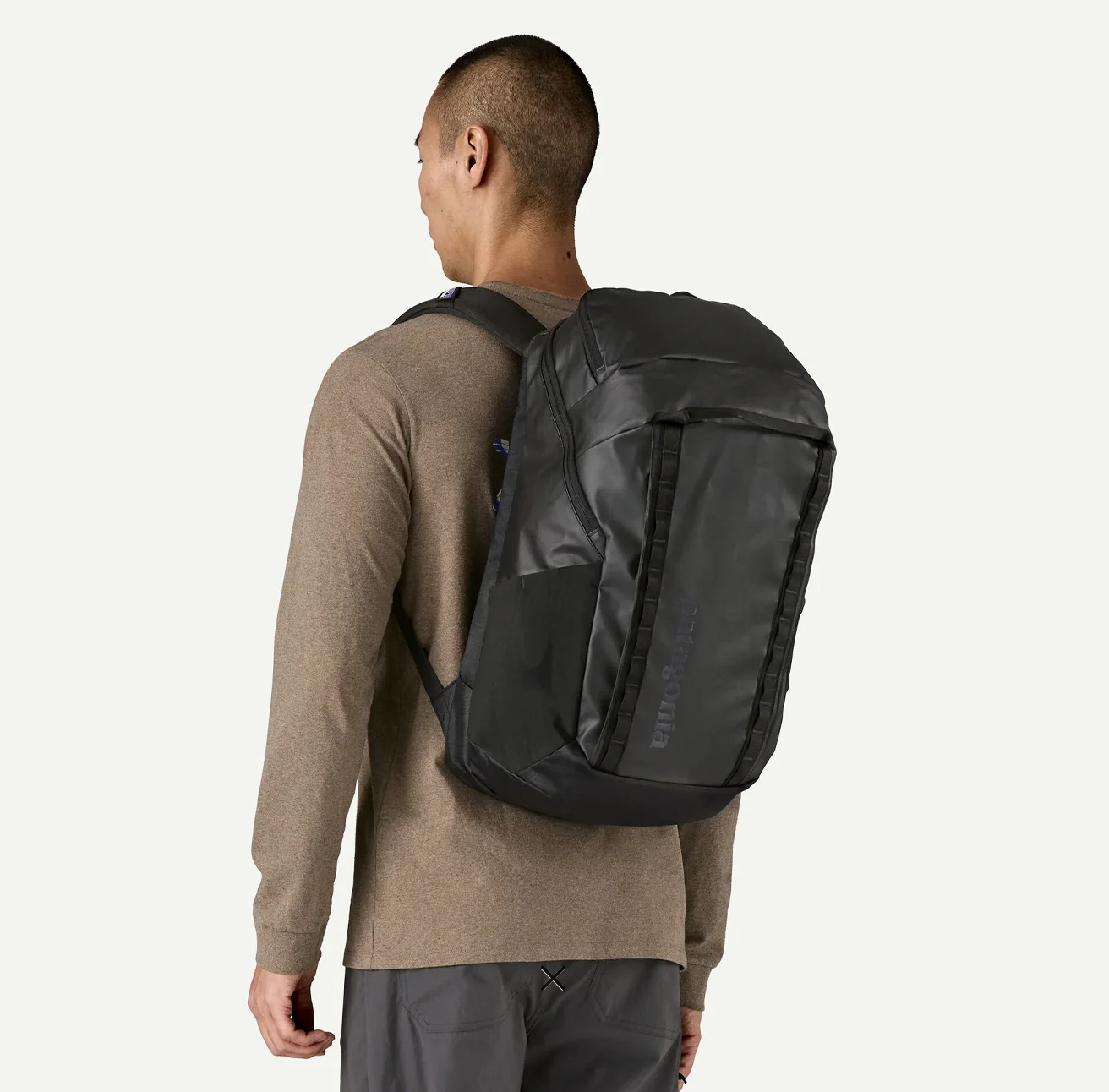 Accessory and pocket detail of Patagonia Black Hole Pack 32L in black.