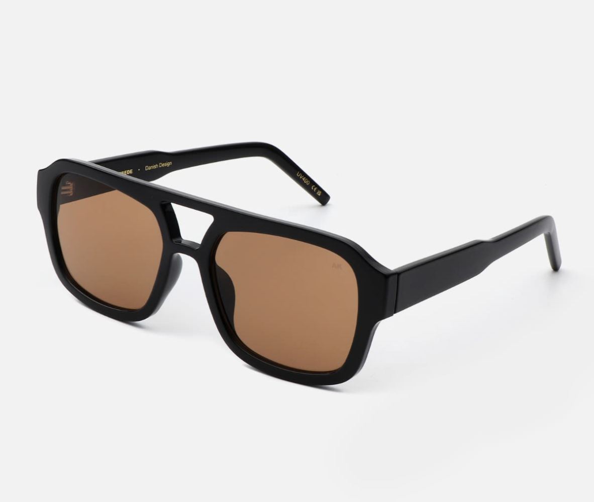 A. Kjærbede Kaya sunglasses in black with Tritan frames and polycarbonate lenses.