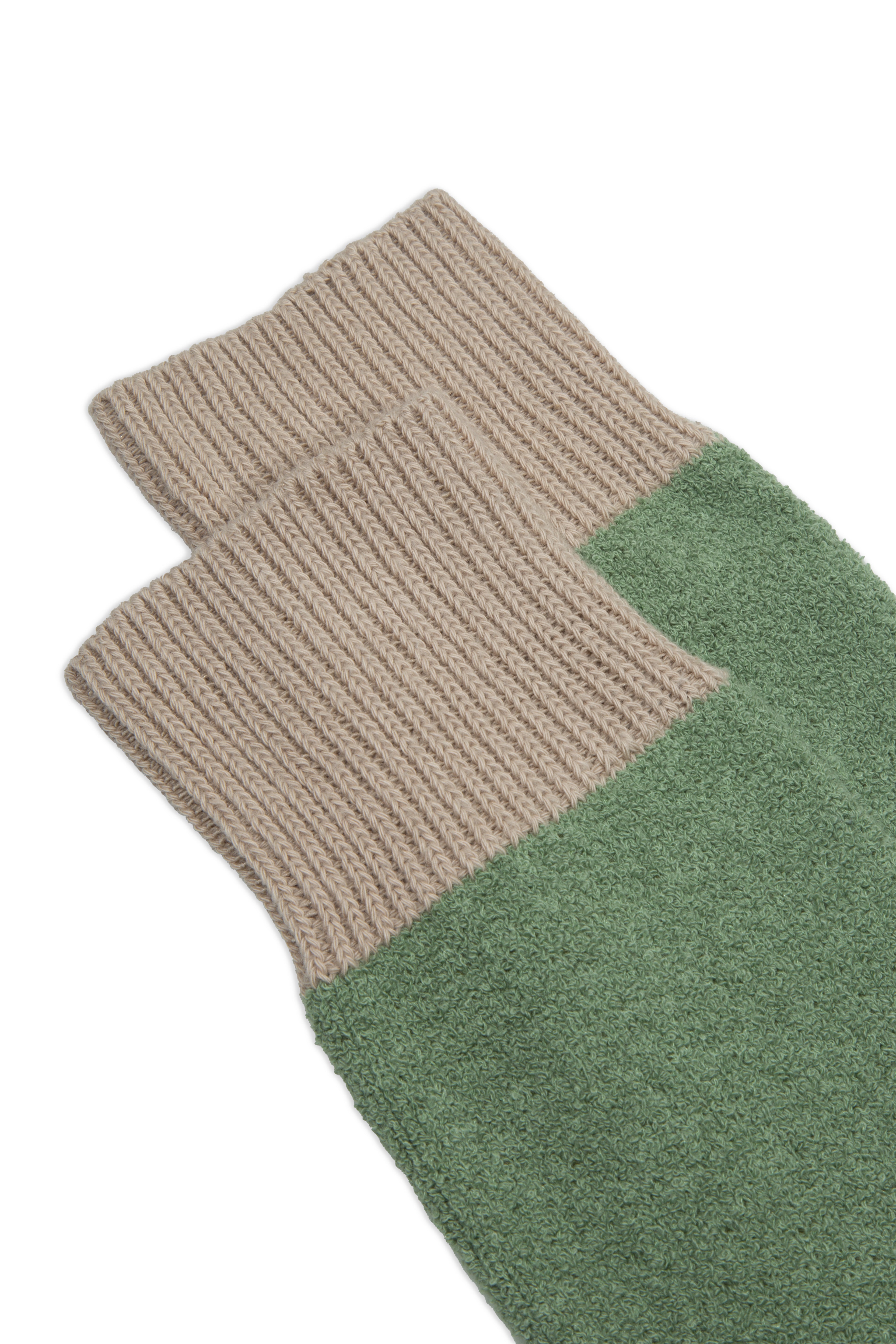 Close-up of Ant45 Zen Socks in light green showing the terry sole and striped cuff.
